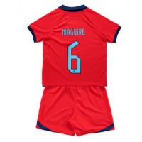 Koszulka piłkarska Anglia Harry Maguire #6 Strój wyjazdowy dla dzieci MŚ 2022 tanio Krótki Rękaw (+ Krótkie spodenki)